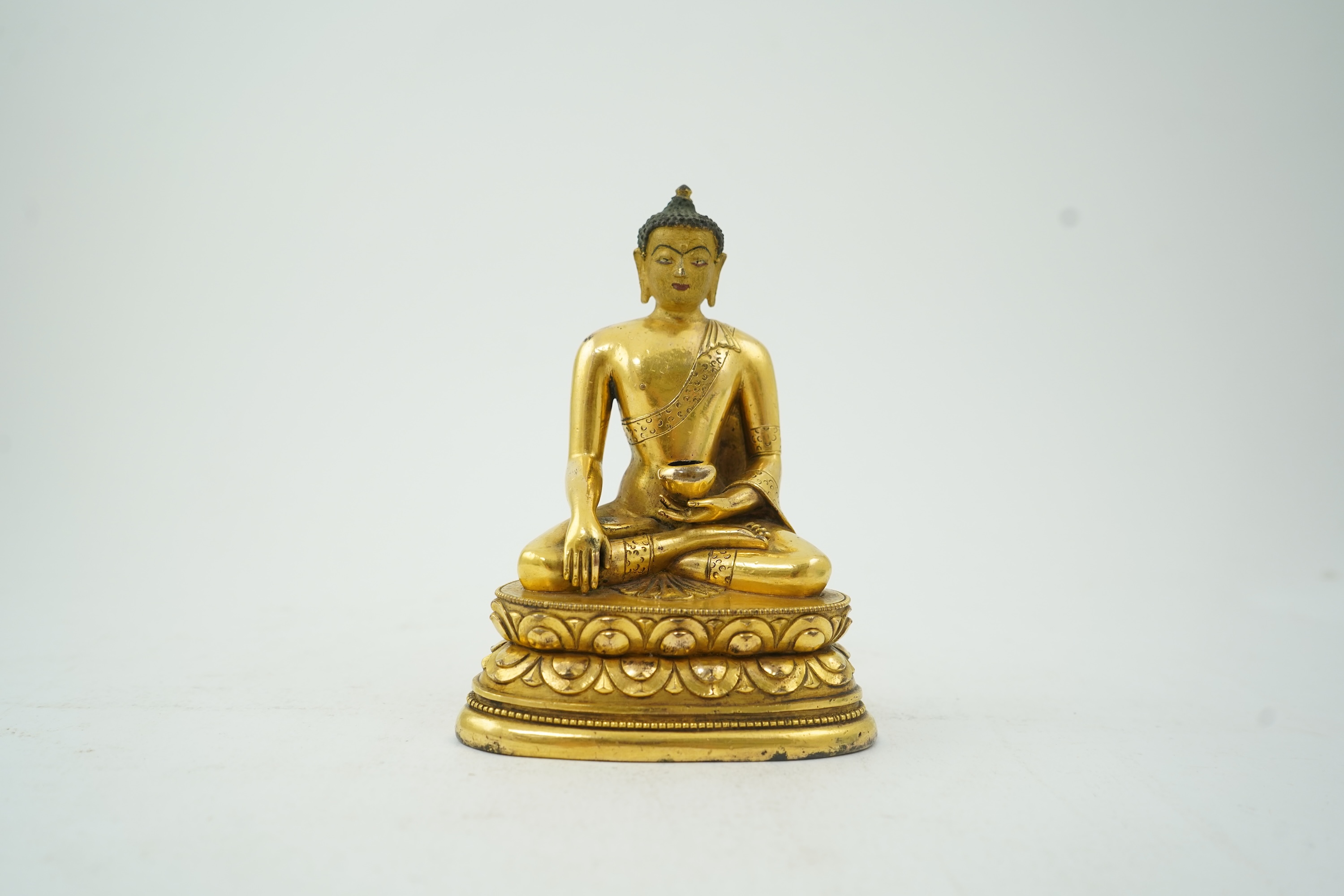 A Mongolian gilt-bronze figure of Buddha Shakyamuni, possibly 18th century